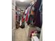 Walk-in closet with ample storage, filled with clothes and personal belongings at 1355 Grass Creek Ave # 1, Henderson, NV 89012