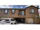Inviting two-story townhome featuring multiple garages and a balcony at 1355 Grass Creek Ave # 1, Henderson, NV 89012