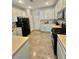 Spacious kitchen features white cabinets, modern appliances, and ample counter space at 1355 Grass Creek Ave # 1, Henderson, NV 89012