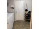 Laundry room with washer and dryer hookups and convenient storage shelves for household essentials at 1355 Grass Creek Ave # 1, Henderson, NV 89012