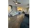 Bright and airy living room with hardwood floors open to the kitchen at 1355 Grass Creek Ave # 1, Henderson, NV 89012