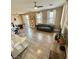 Spacious living room featuring a ceiling fan, modern furniture, and plenty of natural light at 1355 Grass Creek Ave # 1, Henderson, NV 89012