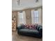 Cozy living room area with ample natural light and a comfortable couch at 1355 Grass Creek Ave # 1, Henderson, NV 89012