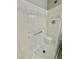 Tiled shower features a built-in seat and convenient shelving for toiletries at 1355 Grass Creek Ave # 1, Henderson, NV 89012