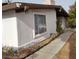Single-story home featuring a stucco exterior, covered entryway, and well-maintained landscaping at 1413 Bryn Mawr Ave, Las Vegas, NV 89102