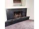 Close-up shot of a sleek black fireplace with brass accents adding vintage charm at 1413 Bryn Mawr Ave, Las Vegas, NV 89102