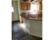 Eat-in kitchen featuring granite counters, wood cabinets, and wooden flooring at 1413 Bryn Mawr Ave, Las Vegas, NV 89102