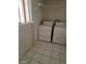 Laundry room with washer, dryer, tile flooring and a window at 1413 Bryn Mawr Ave, Las Vegas, NV 89102