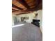 A spacious living room boasting a unique wooden beam ceiling and a cozy fireplace at 1413 Bryn Mawr Ave, Las Vegas, NV 89102