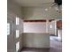 Living room showing the open floor plan and view to the kitchen with white paint at 1413 Bryn Mawr Ave, Las Vegas, NV 89102