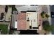 Aerial view showcasing a home with a rooftop patio, manicured backyard, and proximity to nearby amenities and community features at 156 Campbelltown Ave, Henderson, NV 89015