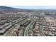 Sweeping aerial view captures a vast community, showcasing the density of homes, roadways, and overall urban landscape at 156 Campbelltown Ave, Henderson, NV 89015