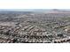Expansive aerial view of a vibrant residential community nestled amidst a picturesque desert landscape at 156 Campbelltown Ave, Henderson, NV 89015
