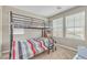 Cozy bedroom featuring a bunk bed and natural light from the windows at 156 Campbelltown Ave, Henderson, NV 89015