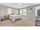 Relaxing bedroom with plush carpet, three windows and neutral tones for a cozy retreat at 156 Campbelltown Ave, Henderson, NV 89015