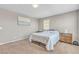 This cozy bedroom features a soft carpet, neutral walls, and a comfortable bed setting at 156 Campbelltown Ave, Henderson, NV 89015