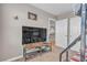 Bedroom featuring a bunk bed, television, storage shelves, and a closet at 156 Campbelltown Ave, Henderson, NV 89015