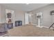 Carpeted bedroom featuring three doors, neutral walls, and tan carpet at 156 Campbelltown Ave, Henderson, NV 89015