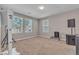 Neutral bedroom with large windows providing natural light and tan carpet at 156 Campbelltown Ave, Henderson, NV 89015