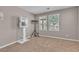 This bedroom features two windows and neutral carpeting, providing a bright, comfortable space at 156 Campbelltown Ave, Henderson, NV 89015