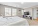A spacious bedroom featuring neutral colors, three windows, and a comfortable carpet at 156 Campbelltown Ave, Henderson, NV 89015