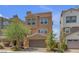 Attractive two-story house boasts a private two-car garage and easy-care landscaping at 156 Campbelltown Ave, Henderson, NV 89015