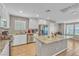 Bright kitchen with white cabinetry, granite countertops, and stainless steel appliances at 156 Campbelltown Ave, Henderson, NV 89015
