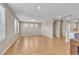 Bright, open living area featuring wood tile flooring and multiple windows that provide abundant natural light at 156 Campbelltown Ave, Henderson, NV 89015