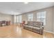 Inviting living area with wood tile flooring, abundant natural light, and comfortable seating for relaxation at 156 Campbelltown Ave, Henderson, NV 89015