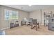Cozy home office with a large window, comfortable seating, and functional workspace at 156 Campbelltown Ave, Henderson, NV 89015