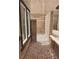 Exterior view of a gated section of the backyard with a rock garden and concrete-block wall at 167 Desert Pond Ave, Henderson, NV 89002