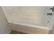Clean white bathtub with chrome fixtures in a well-maintained bathroom at 167 Desert Pond Ave, Henderson, NV 89002