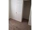 Bedroom with carpeting and a partially opened closet with wire shelving at 167 Desert Pond Ave, Henderson, NV 89002