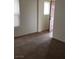 A bright bedroom with tan carpet and natural light coming in through the window at 167 Desert Pond Ave, Henderson, NV 89002