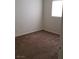 Compact bedroom bathed in natural light from a window, with cozy carpeting at 167 Desert Pond Ave, Henderson, NV 89002