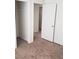 Bedroom leading to a walk-in closet with wire shelving and white doors at 167 Desert Pond Ave, Henderson, NV 89002