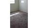 Bedroom with neutral carpeting, light walls, and natural light from a window at 167 Desert Pond Ave, Henderson, NV 89002