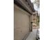 Beige two-car garage featuring paneled doors and exterior view to a home at 167 Desert Pond Ave, Henderson, NV 89002
