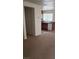 An open-concept kitchen with wooden cabinets and a white dishwasher at 167 Desert Pond Ave, Henderson, NV 89002
