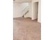 An empty living room with staircase at 167 Desert Pond Ave, Henderson, NV 89002