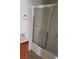 Shower with sliding glass doors and updated fixtures in a modern bathroom at 167 Desert Pond Ave, Henderson, NV 89002