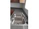 Stainless steel kitchen sink with gray counter top at 167 Desert Pond Ave, Henderson, NV 89002