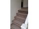 Carpeted staircase with white railing at 167 Desert Pond Ave, Henderson, NV 89002