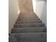 Staircase with neutral carpet and white trim leading to upper level at 167 Desert Pond Ave, Henderson, NV 89002