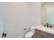 Modern half bathroom features a floating vanity with white countertop and an elongated toilet at 182 Robledo St, Las Vegas, NV 89138