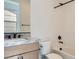 Modern bathroom with marble countertop and sleek black fixtures, plus a tiled tub and shower at 182 Robledo St, Las Vegas, NV 89138