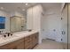 Bathroom featuring a double vanity, modern fixtures, and glass-enclosed shower at 182 Robledo St, Las Vegas, NV 89138