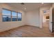 Sunlit bedroom showcases wood floors, large window, and an open doorway to another room at 182 Robledo St, Las Vegas, NV 89138