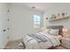 Cozy bedroom featuring neutral tones, soft bedding, and stylish decor at 182 Robledo St, Las Vegas, NV 89138