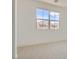 Bright bedroom featuring a large window with scenic mountain views at 182 Robledo St, Las Vegas, NV 89138